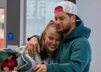 JoJo Siwa and Chris Hughes Spark Romance Rumors with Heathrow Reunion and Affectionate Moments
